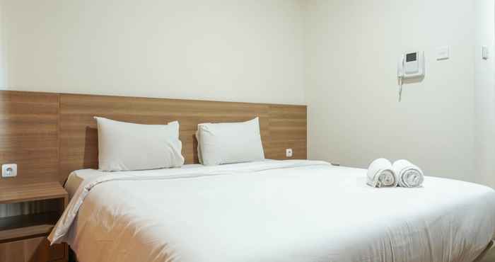 Kamar Tidur Minimalist and Comfy Studio @ Puri Orchard Apartment By Travelio