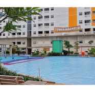 Swimming Pool 3 Cozy 2BR at Green Pramuka City Apartment By Travelio