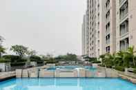 Swimming Pool 2BR Tranquil Apartment at Bintaro Park View By Travelio