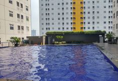 Swimming Pool 3 Cozy 2BR Apartment at Green Pramuka By Travelio