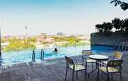 Swimming Pool 6 Elegant Studio Room Apartment at Tamansari Papilio By Travelio