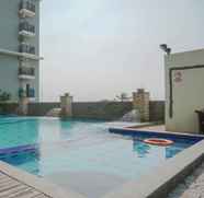 Kolam Renang 2 Comfy Studio Room Apartment at Gading Greenhill By Travelio