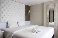 Bedroom Cozy 2BR at Tamansari Tera Residence Apartment near BIP By Travelio