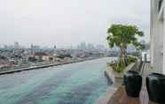 Swimming Pool 2 Cozy 2BR Apartment with City View at Nine Residence By Travelio