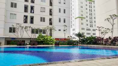 Swimming Pool 4 Bassura City 2BR Apartment with Nice Interior Design By Travelio