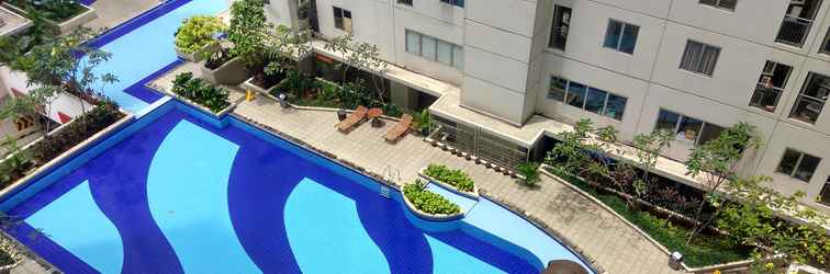 Lobby 1BR Minimalist with Pool View at Bassura City Apartment By Travelio