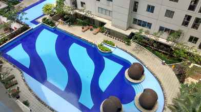 Lobi 1BR Minimalist with Pool View at Bassura City Apartment By Travelio