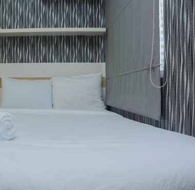 Bedroom 2 1BR Minimalist with Pool View at Bassura City Apartment By Travelio
