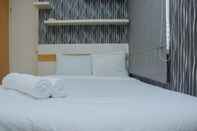 ห้องนอน 1BR Minimalist with Pool View at Bassura City Apartment By Travelio