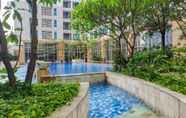 Swimming Pool 7 Modern and Comfortable 1BR at Casa Grande By Travelio