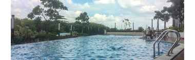 Swimming Pool 2 Posh 1BR The Oasis Cikarang Apartment By Travelio