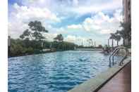 Swimming Pool Posh 1BR The Oasis Cikarang Apartment By Travelio