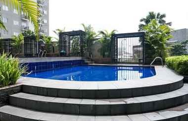 Swimming Pool 2 2BR Simply Furnished Apartment at Puri Park View By Travelio