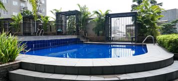 Swimming Pool 2 2BR Simply Furnished Apartment at Puri Park View By Travelio