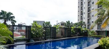 Swimming Pool 3 2BR Simply Furnished Apartment at Puri Park View By Travelio