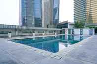 Swimming Pool 2BR Comfortable Deluxe at The Empyreal Condominium Epicentrum Apartment By Travelio