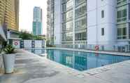 Swimming Pool 4 2BR Comfortable Deluxe at The Empyreal Condominium Epicentrum Apartment By Travelio