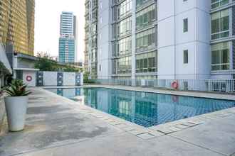 Swimming Pool 4 2BR Comfortable Deluxe at The Empyreal Condominium Epicentrum Apartment By Travelio