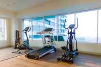 Fitness Center 1 BR Minimalist and Homey Grand Kamala Lagoon Apartment By Travelio