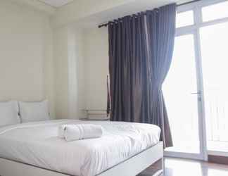 Bedroom 2 Studio Homey with City View Apartment at Puri Orchard By Travelio