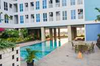 Swimming Pool Studio Homey and Relaxing at Grand Dhika City Apartment By Travelio