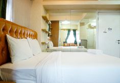 Bedroom 2 Studio Furnished with Comfortable Design Green Pramuka Apartment By Travelio