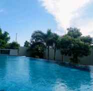 Swimming Pool 4 1BR Homey and Comfortable Apartment at Royal Olive Residence By Travelio