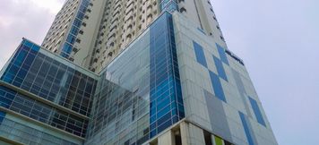 Bangunan 5 2BR Homey and Modern Apartment at Atlanta Residence By Travelio