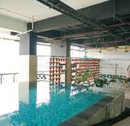 Swimming Pool 3 2BR Homey and Modern Apartment at Atlanta Residence By Travelio