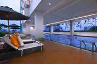 Swimming Pool 1BR Modern Apartment with City View at H Residence By Travelio