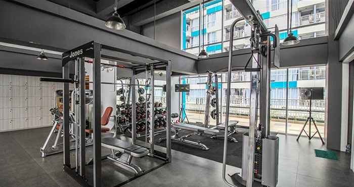 Fitness Center 1BR Modern Apartment with City View at H Residence By Travelio