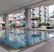 Swimming Pool 3 1BR Modern Apartment with City View at H Residence By Travelio