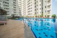 Swimming Pool 2BR Zestful Apartment at Parahyangan Residence By Travelio