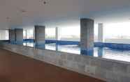 Swimming Pool 4 Studio Minimalist Apartment at Poris 88 with City View By Travelio