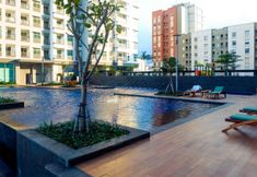 Swimming Pool 2 2BR Cozy and Minimalist Green Bay Condominium Apartment By Travelio
