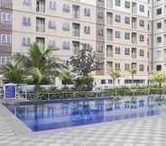 Swimming Pool 2 Minimalist 2BR Titanium Square Apartment By Travelio