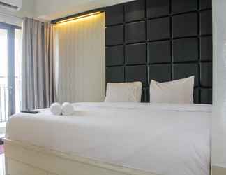 Bedroom 2 Minimalist Studio Apartment at Atria Residences with Pool View By Travelio
