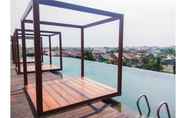 Swimming Pool 2 Modern Studio Apartment @ Grand Kamala Lagoon By Travelio