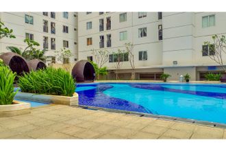 Kolam Renang 4 Fully Furnished and Cozy 2BR at Bassura City Apartment By Travelio