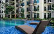 Swimming Pool 3 Minimalist New Furnished 1BR at Puri Orchard Apartment By Travelio