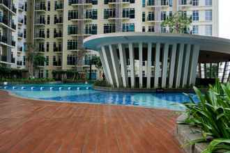 Swimming Pool 4 Minimalist New Furnished 1BR at Puri Orchard Apartment By Travelio