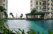 Swimming Pool 7 Minimalist New Furnished 1BR at Puri Orchard Apartment By Travelio