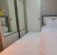 Bedroom 2 Emerald 2BR Apartment Gading Nias By Travelio