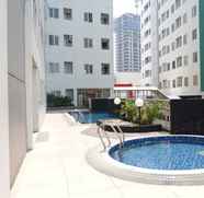 Swimming Pool 3 2BR Apartment Modern at Pavilion Permata By Travelio