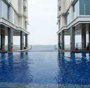 Kolam Renang 2 Studio Spacious with Sofa Bed at Ancol Mansion Apartment By Travelio