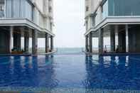 Swimming Pool Studio Spacious with Sofa Bed at Ancol Mansion Apartment By Travelio