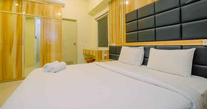 Bedroom Strategic 2BR with Workspace @ Season City Apartment By Travelio