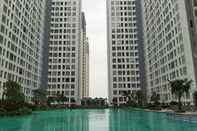 Swimming Pool New Furnished 2BR at Serpong M-Town Residence Apartment By Travelio