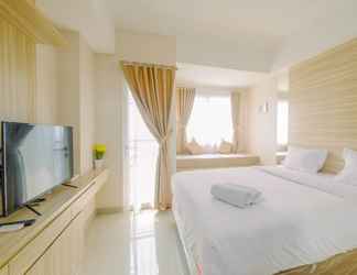 Bedroom 2 Homey and Warm Studio at The Oasis Cikarang Apartment By Travelio