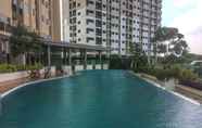 Swimming Pool 4 Homey and Warm Studio at The Oasis Cikarang Apartment By Travelio